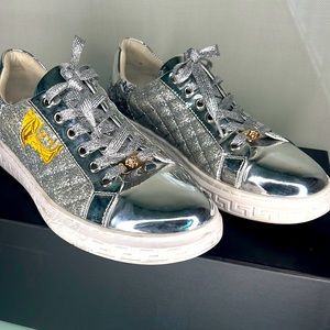 A pair of Versace shoes. With little use.